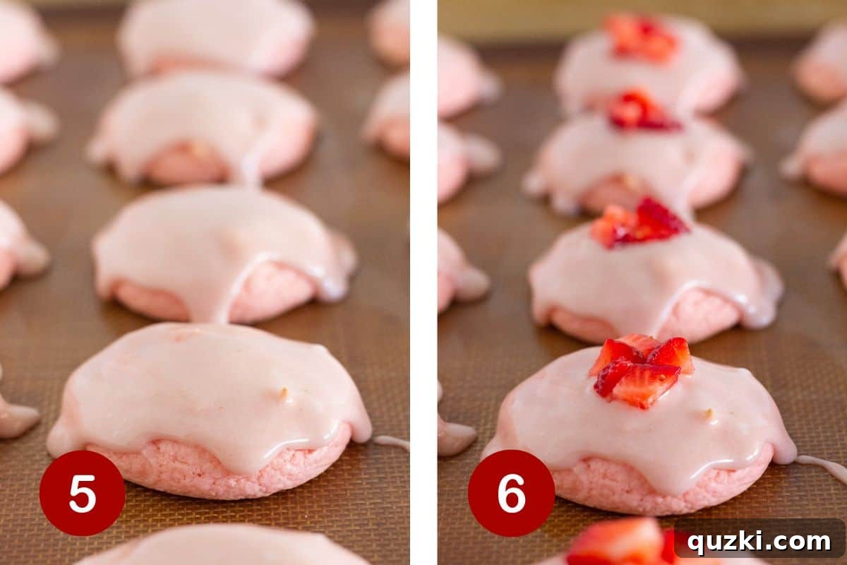 Pillowy Strawberry Cake Cookies 6 The finished strawberry cookies being topped with homemade glaze and fresh strawberries for serving.