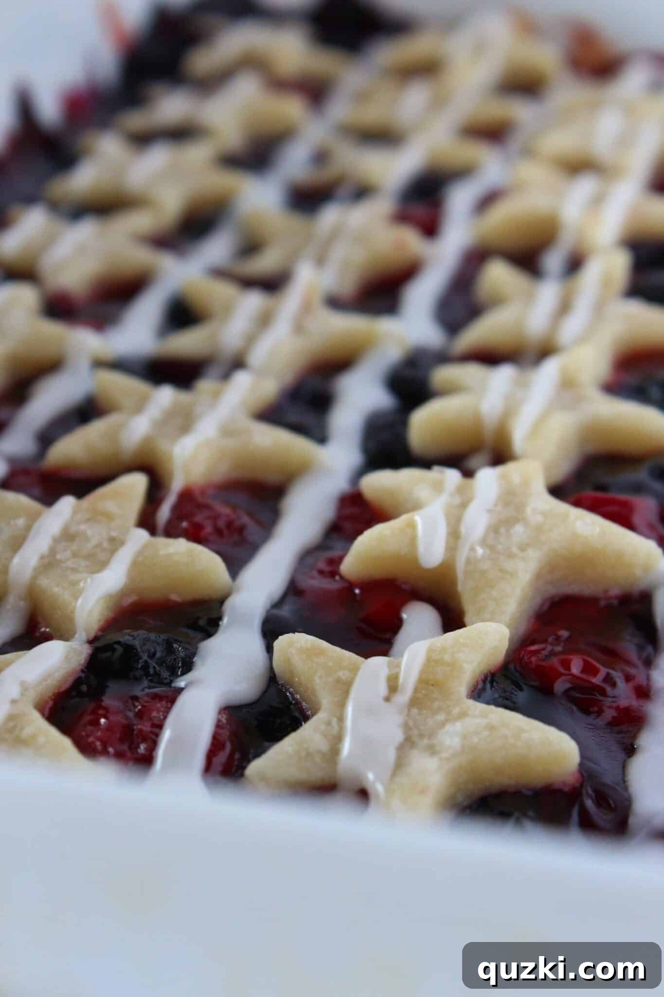 Festive Fourth of July Cookie Bars 2 Patriotic Desserts: 4th of July Star Spangled Banner Bars, a recipe featuring a rich cream cheese sugar cookie base with cherry and blueberry filling.