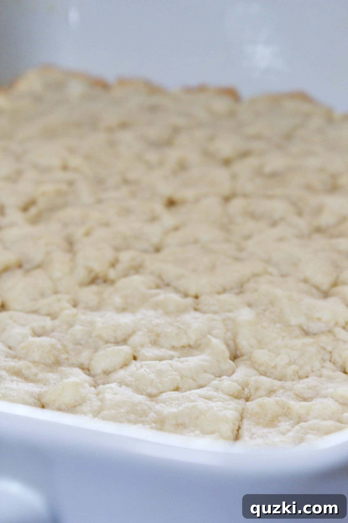 Festive Fourth of July Cookie Bars 5 The partially baked cream cheese sugar cookie crust, golden brown around the edges, ready for the fruit filling in the 4th of July cookie bars recipe.