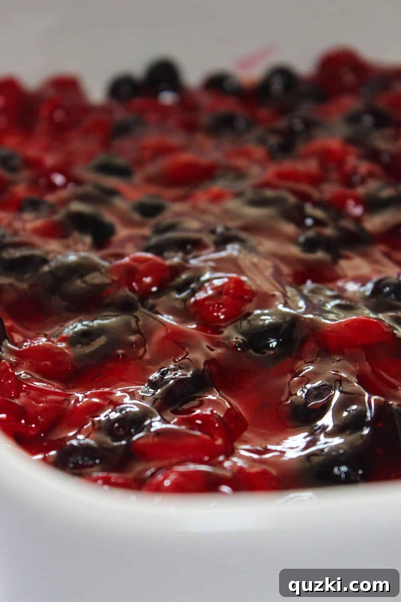 Festive Fourth of July Cookie Bars 7 Spreading the cherry and blueberry mixture evenly over the par-baked cookie crust for a beautiful and delicious 4th of July dessert.