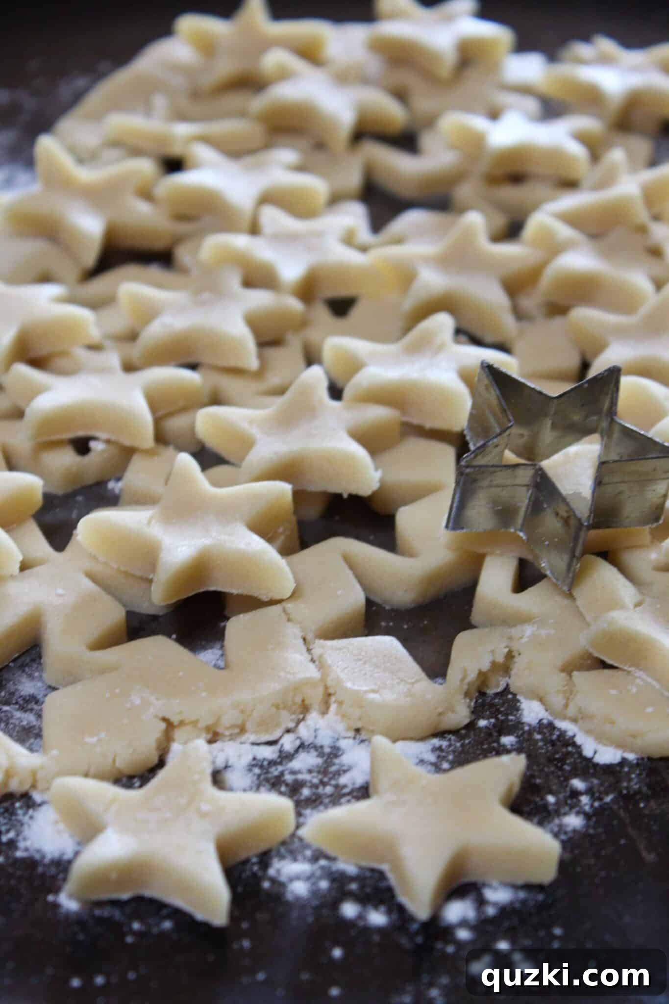 Festive Fourth of July Cookie Bars 8 Small star-shaped cookie dough cutouts ready to be placed as a patriotic topping on the 4th of July cookie bars.