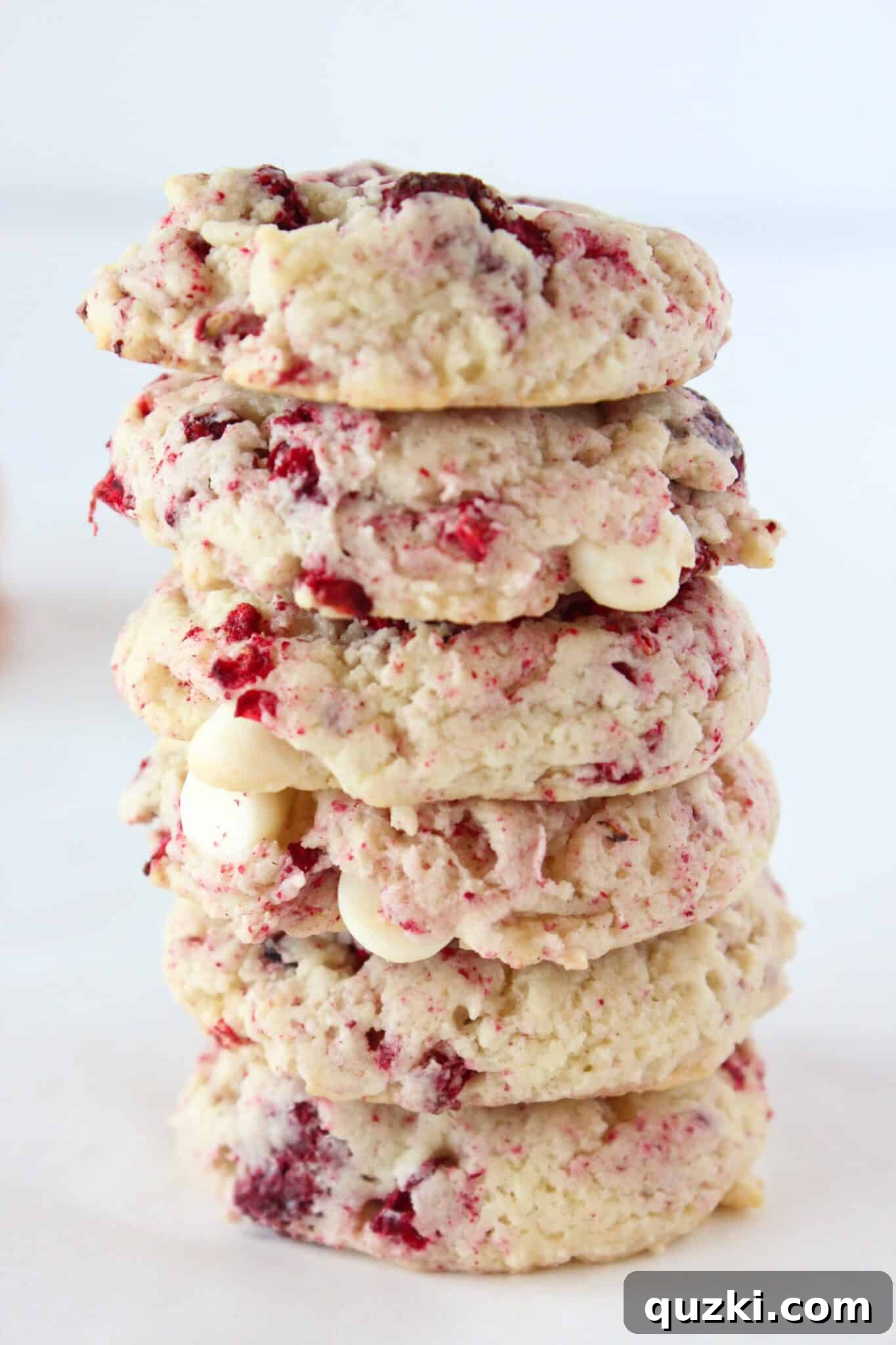 Subway's Iconic Raspberry Cheesecake Cookies Make Them At Home 12 Spread of Copycat Subway Raspberry Cheesecake Cookies on a wooden board, showcasing their inviting appearance.