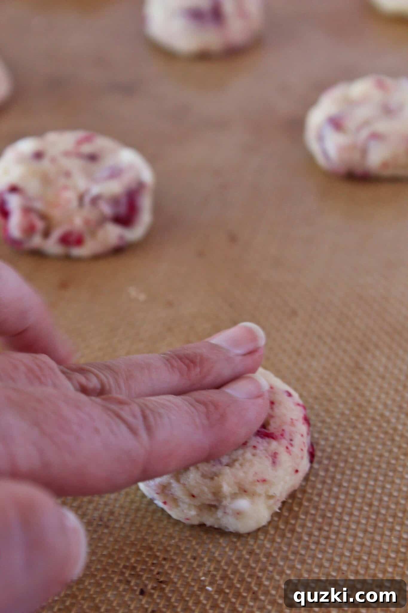 Subway's Iconic Raspberry Cheesecake Cookies Make Them At Home 9 Gently pressing down on scooped cookie dough with fingertips before baking Copycat Subway Raspberry Cheesecake Cookies.