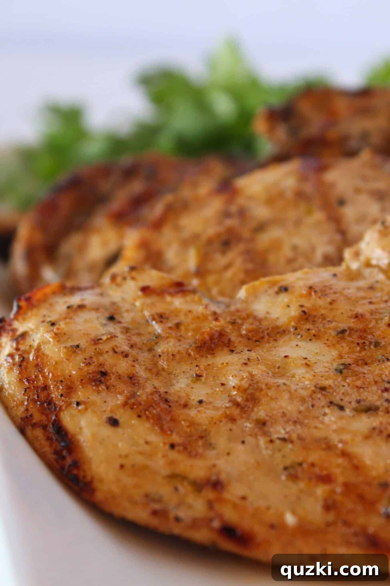 Simple Marinade for Succulent Chicken 2 Perfectly grilled marinated chicken served on a rustic wooden tray, ready to enjoy.