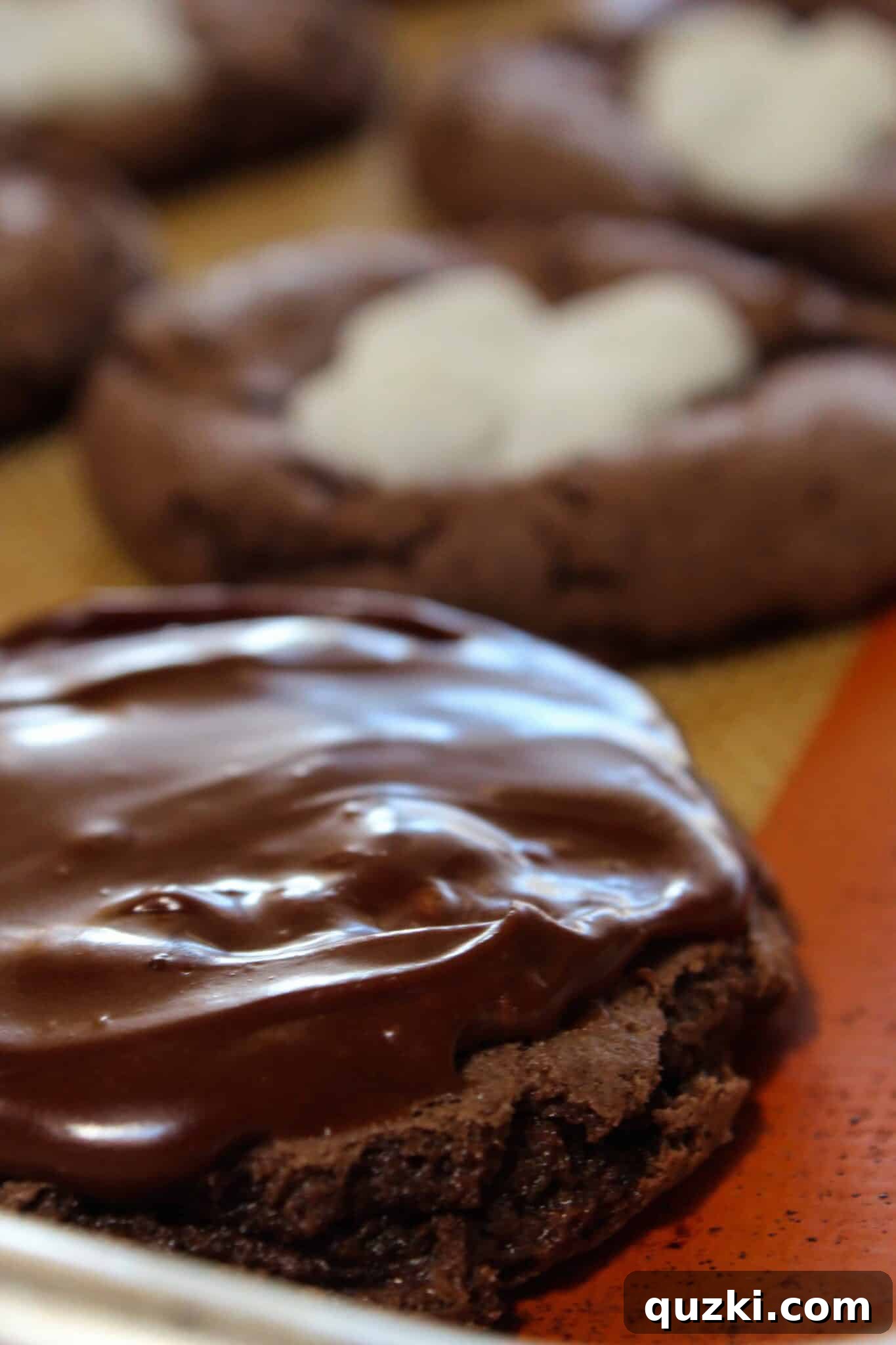 A plate of perfectly frosted Mississippi Mud Cookies ready to enjoy