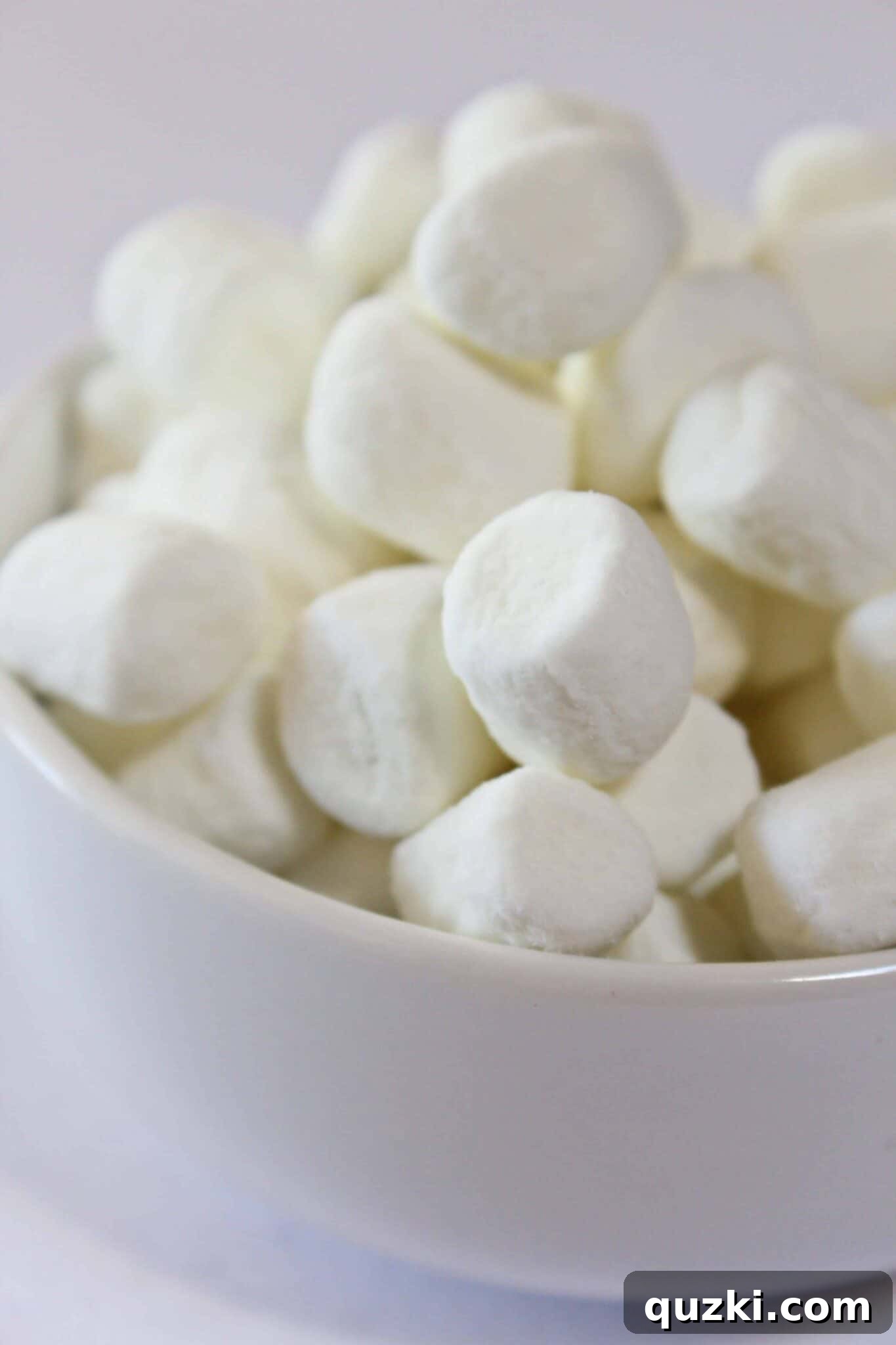 Adding mini marshmallows to Mississippi Mud Cookies before the second bake