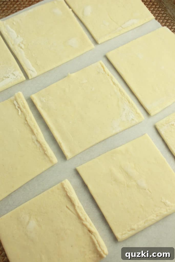 Preparing puff pastry squares for pot pie topping
