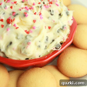 Chocolate Chip Cookie Dough Dip in a white bowl with dippers