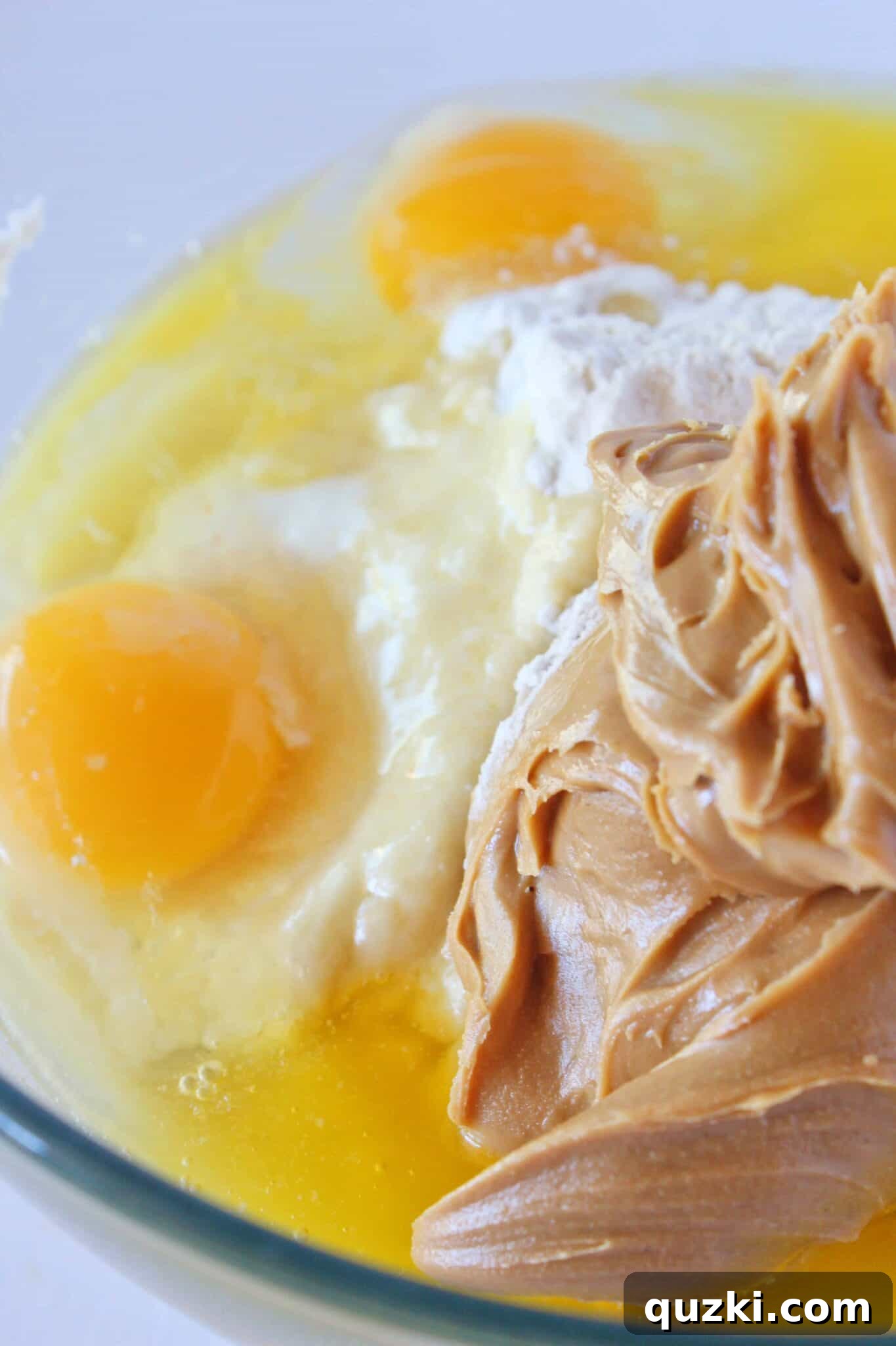 Making the cookie dough by combining ingredients in a bowl.