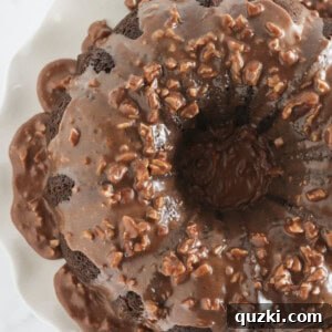 Decadent Texas Sheet Cake Bundt 10 A finished Texas Sheet Cake Bundt Cake with chocolate pecan frosting, showcasing a perfect slice.