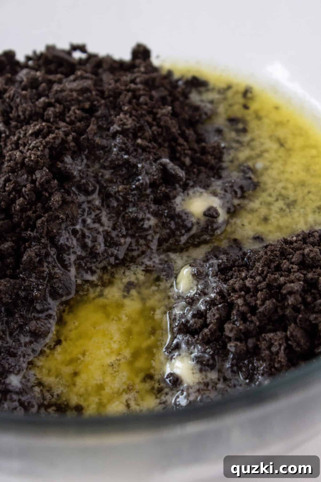 Frightfully Delicious No-Bake Candy Cheesecake 6 The butter-infused Oreo crust pressed firmly into a springform pan, ready for chilling.
