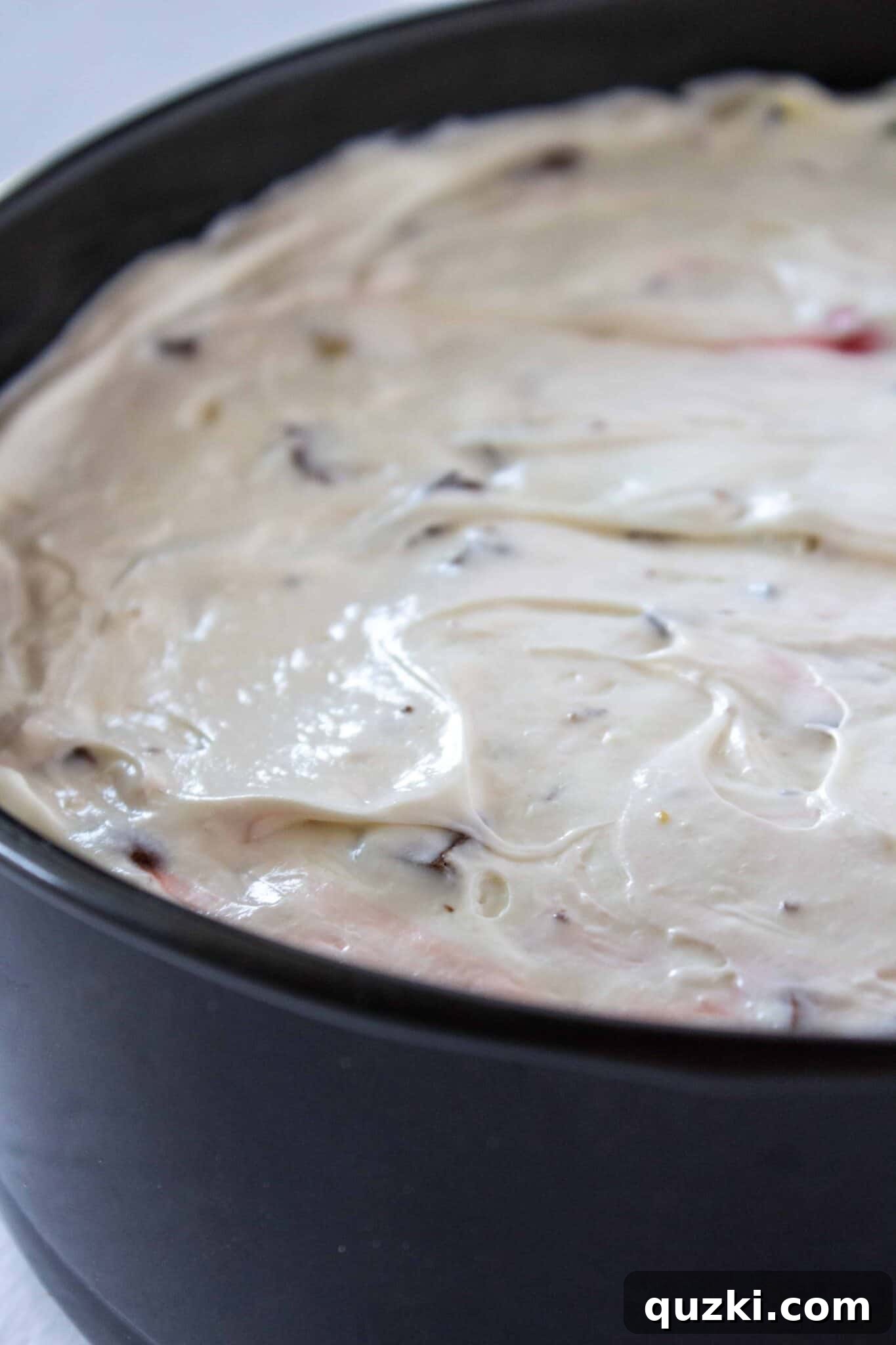 Frightfully Delicious No-Bake Candy Cheesecake 10 The cheesecake filling spread evenly over the Oreo crust, with additional candy sprinkled on top for decoration.