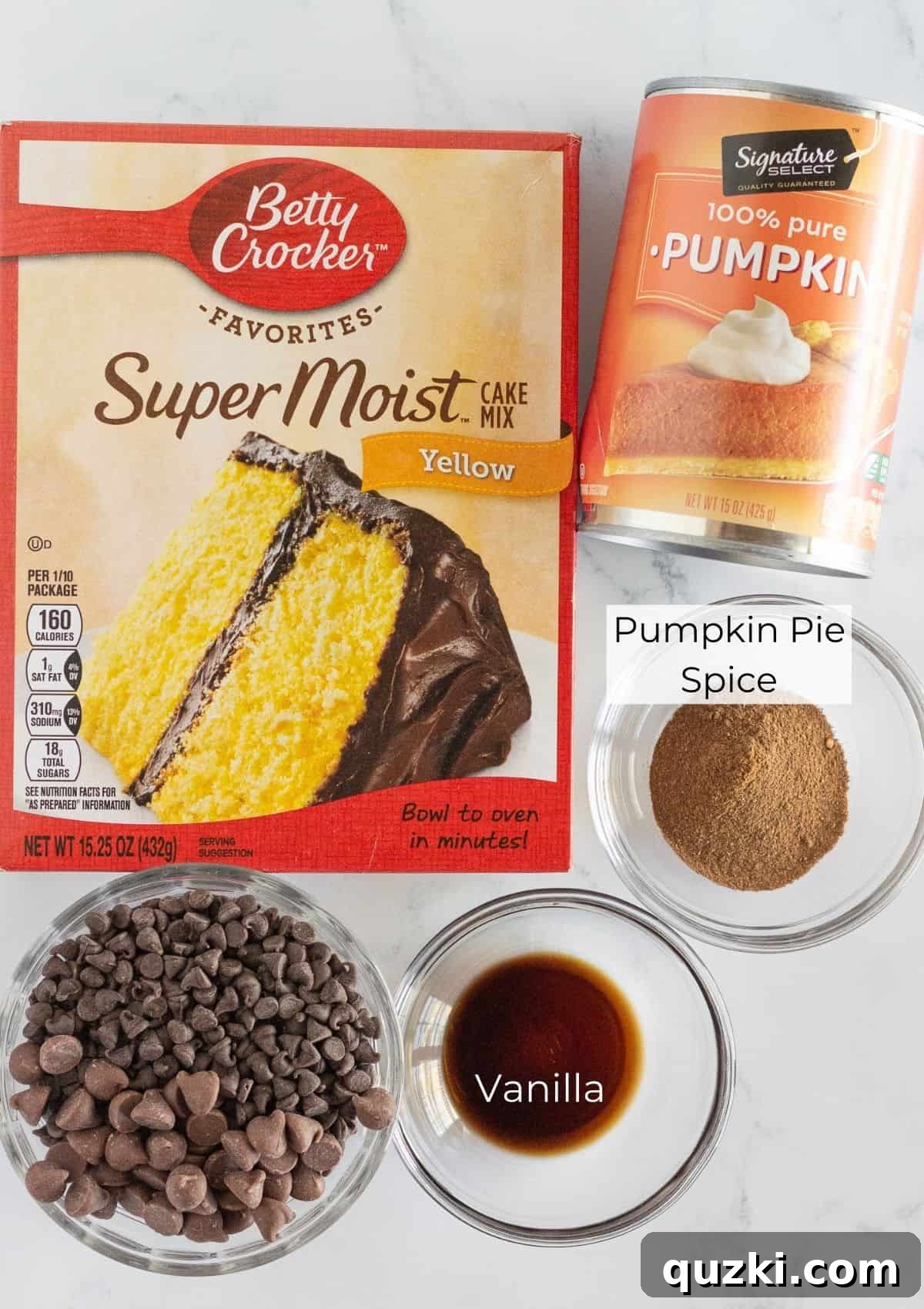 Effortless Cake Mix Pumpkin Chocolate Chip Cookies 3 A flat lay photograph showcasing all the ingredients required to bake a batch of pumpkin chocolate chip cookies, neatly arranged on a kitchen surface.