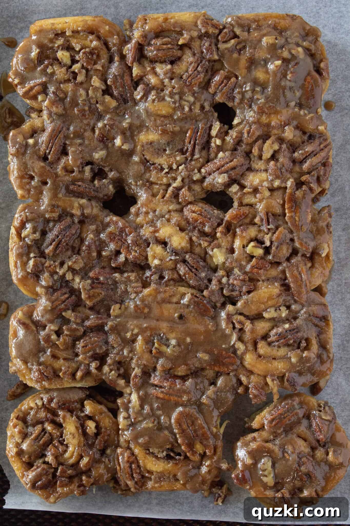 Reheated easy caramel pecan sticky buns on a serving plate, ready to be enjoyed