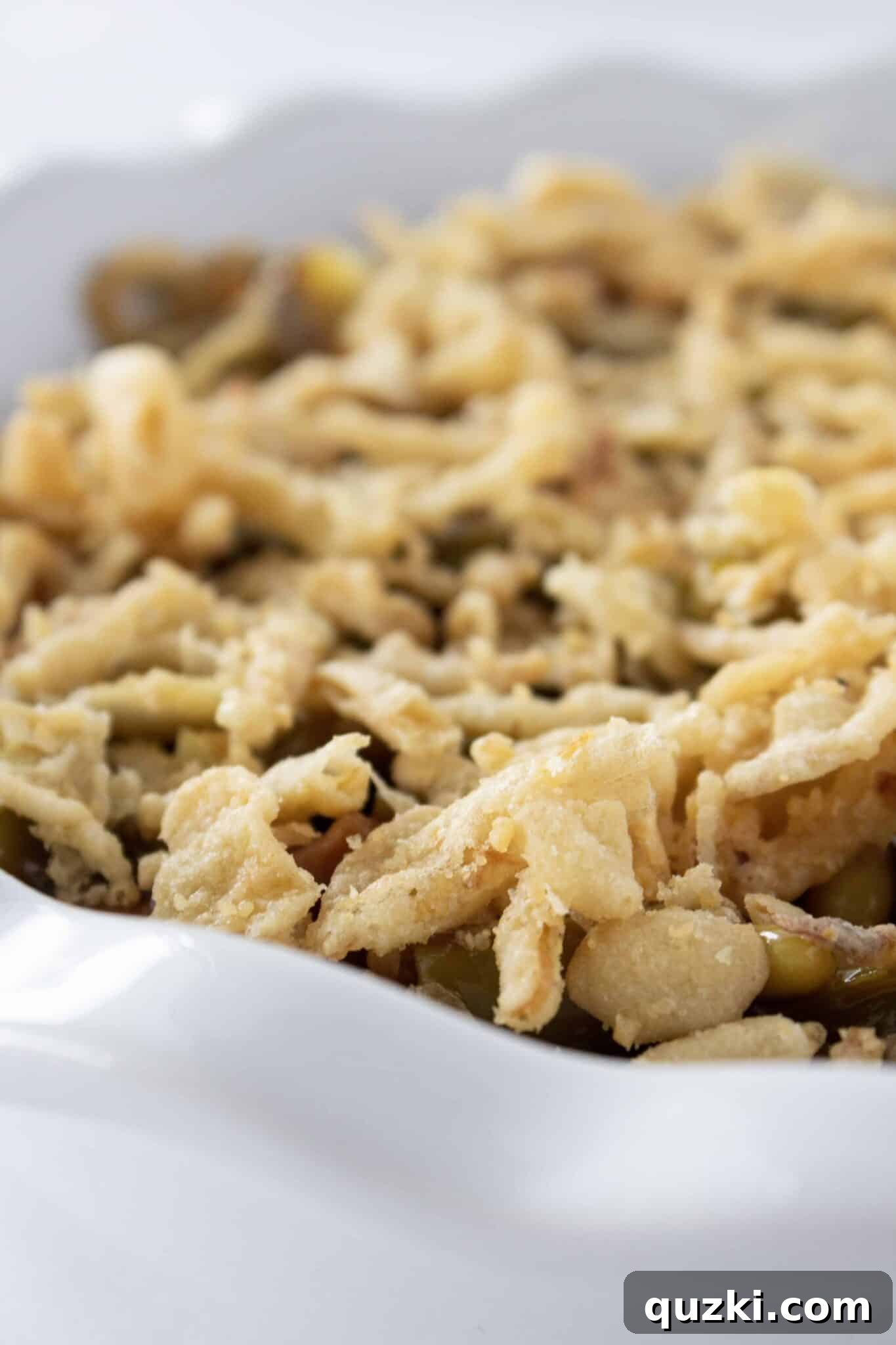 The BBQ Green Bean Casserole baked to a golden brown perfection, showcasing the crispy fried onion topping.