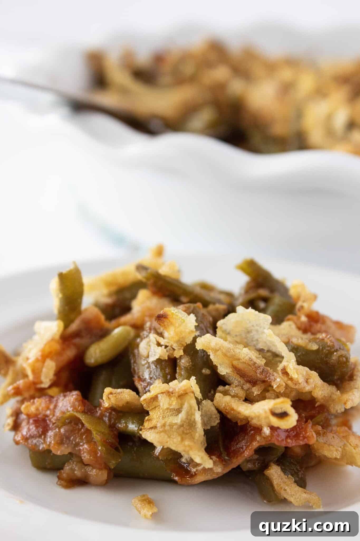 A beautifully presented meal featuring the BBQ Green Bean Casserole as a centerpiece side dish.