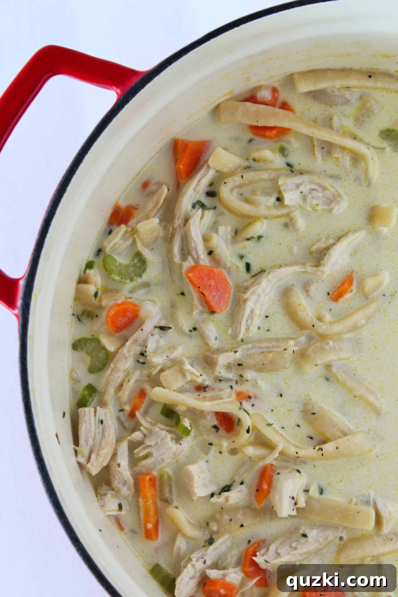 A hearty and easy Creamy Leftover Turkey Noodle Soup, served in a rustic bowl.