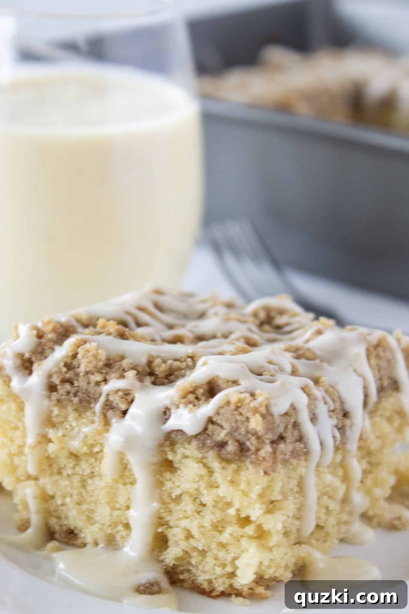 Sweeten Your Christmas Morning: Eggnog Coffee Cake 3 Close-up of Eggnog Coffee Cake slice, showing the moist interior and crumbly topping, perfect for holiday gatherings.