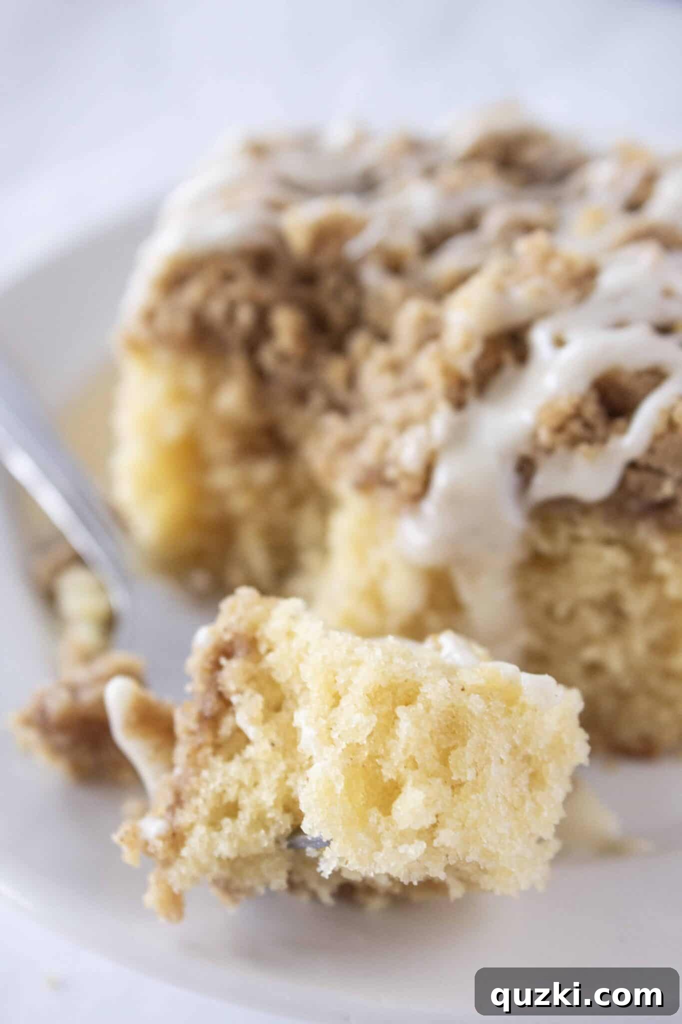 Sweeten Your Christmas Morning: Eggnog Coffee Cake 10 Top-down view of the entire Eggnog Coffee Cake, showing its golden crumb topping and elegant glaze drizzle.