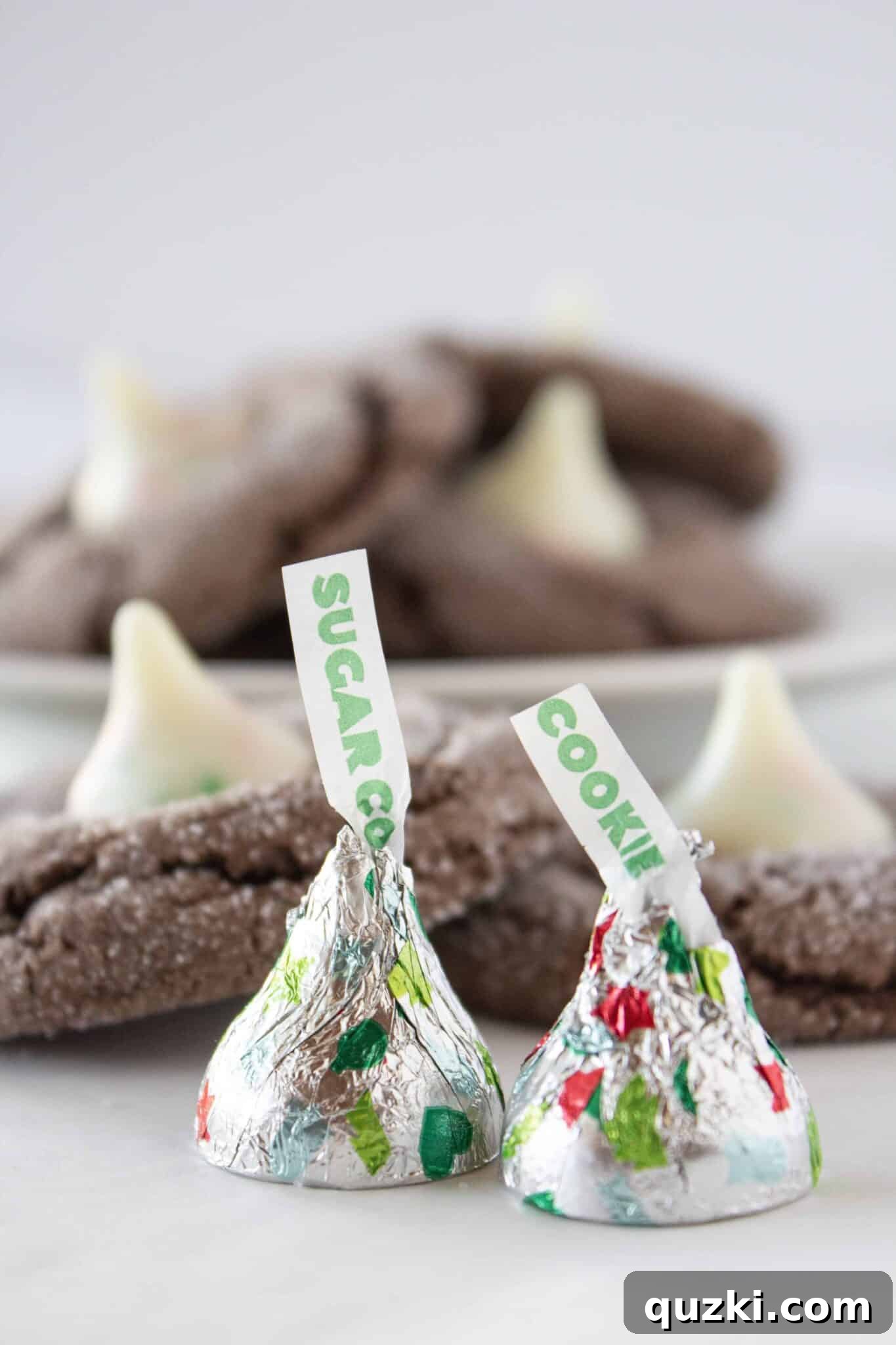 Chocolate Kiss Cookies artfully arranged with Sugar Cookie Kisses on top.