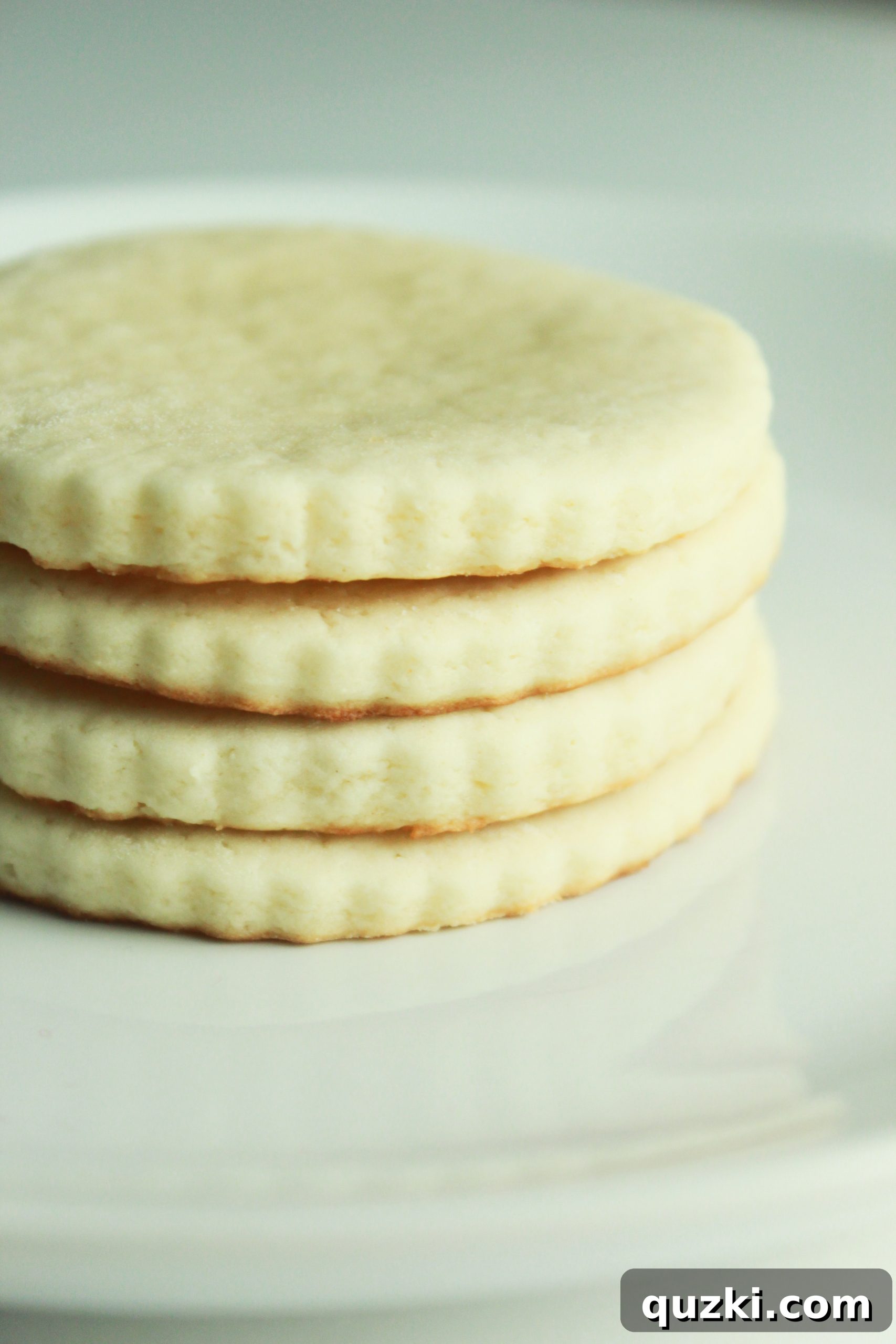 Close-up of freshly baked cream cheese sugar cookies, perfect for Christmas decorating