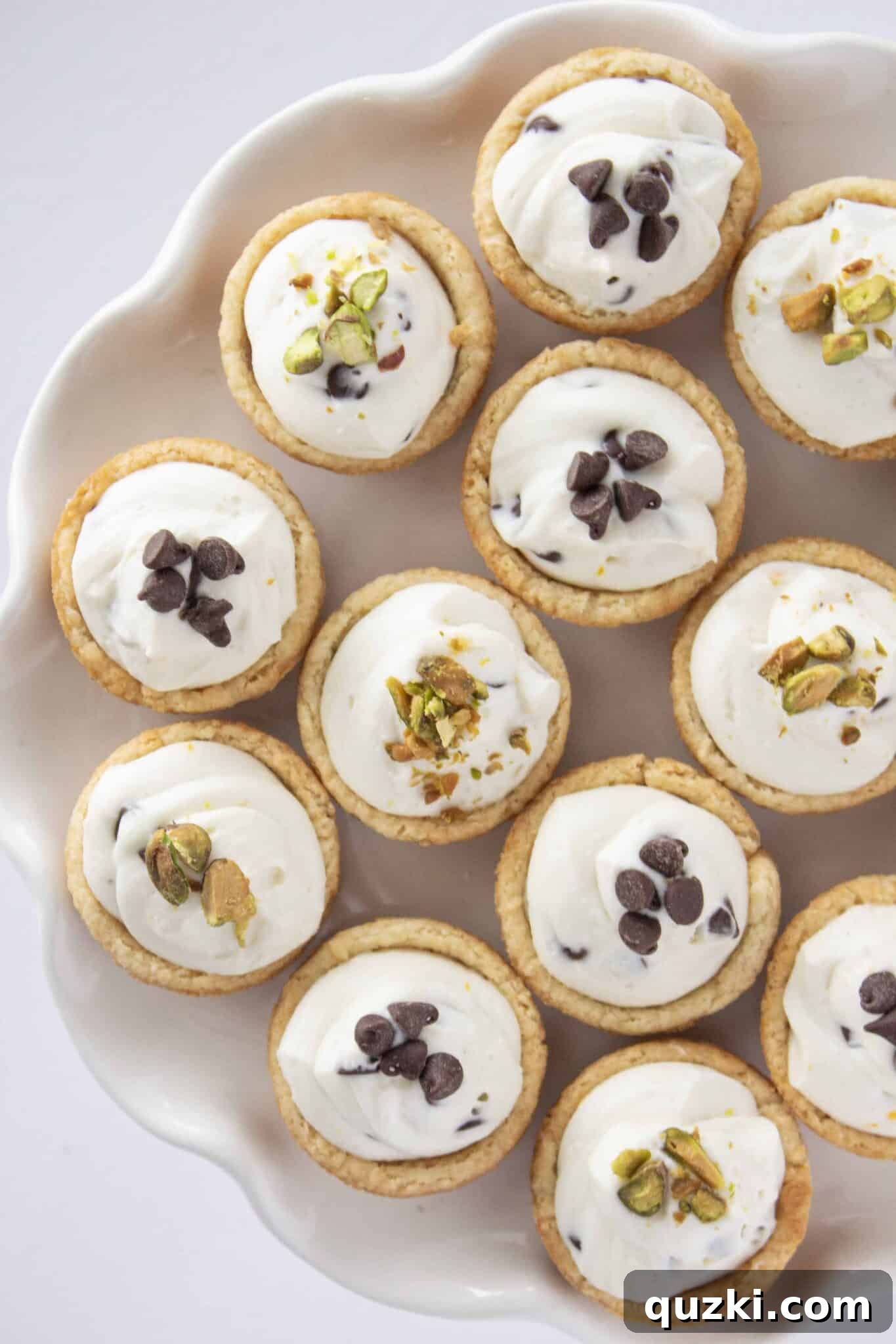 An overhead shot of a tray filled with perfectly made Cannoli Cookie Cups, highlighting their appealing uniformity.