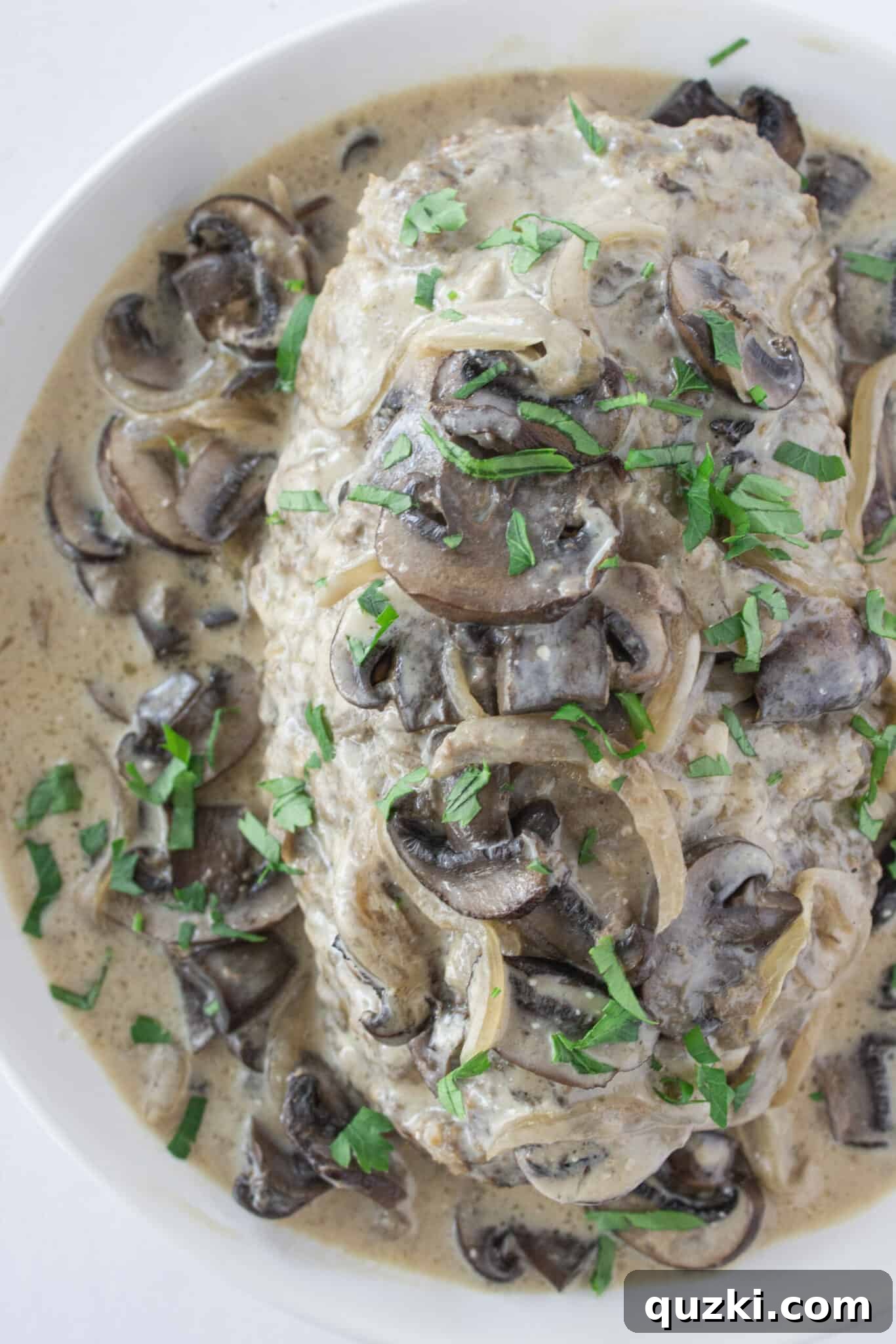 Slicing the finished Easy Crock Pot Beef Stroganoff Meatloaf.