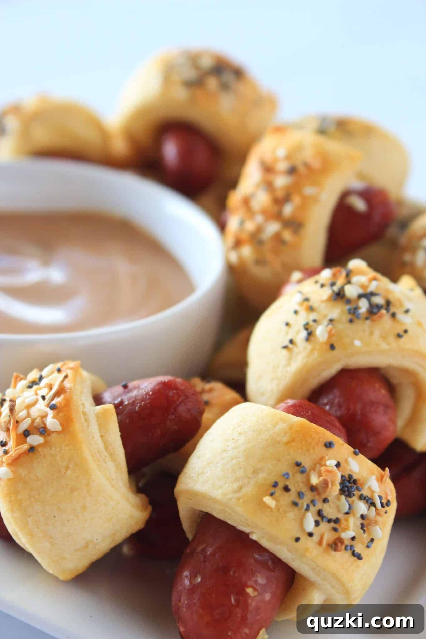 Everything Pigs in a Blanket with a crispy topping, a perfect appetizer for New Year's celebrations
