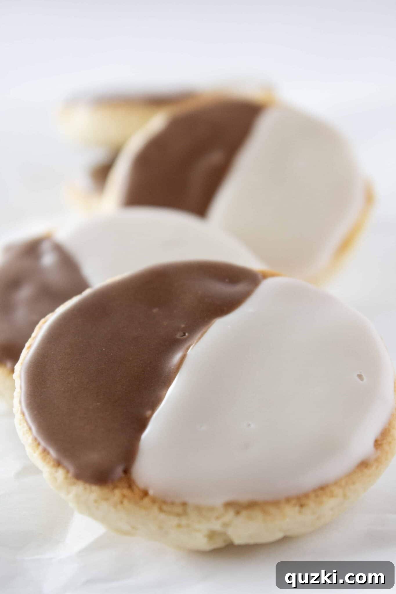 Black & White Half Moon Cookies with vanilla and chocolate frosting, a festive and easy New Year's dessert
