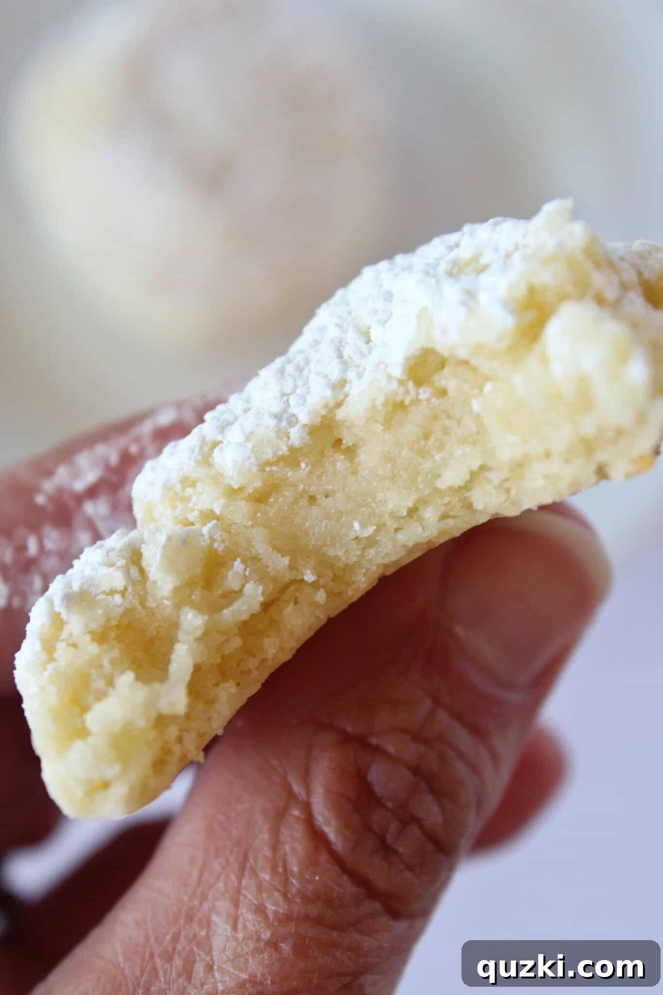Plate of soft Cream Cheese Cake Mix Cookies with powdered sugar