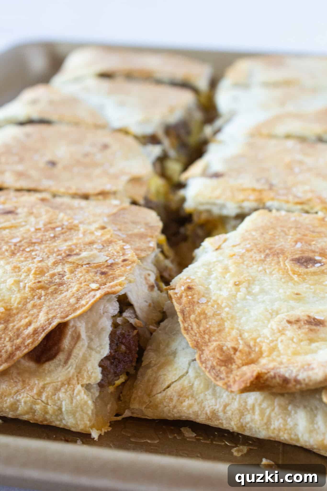 Easy Sheet Pan Breakfast Quesadillas 2 A Sheet Pan Breakfast Quesadilla on a tray and cut into 8 squares.