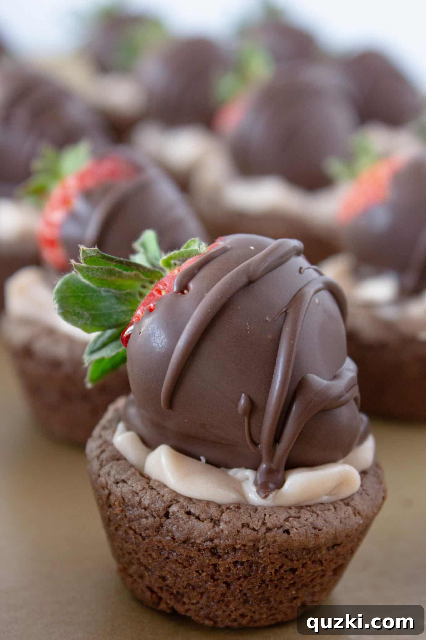 Luscious Chocolate Dipped Strawberry Cookie Cups 2 Chocolate Covered Strawberry Cookie Cups arranged beautifully on a rustic baking sheet, highlighting their rich chocolate base and vibrant strawberry topping.