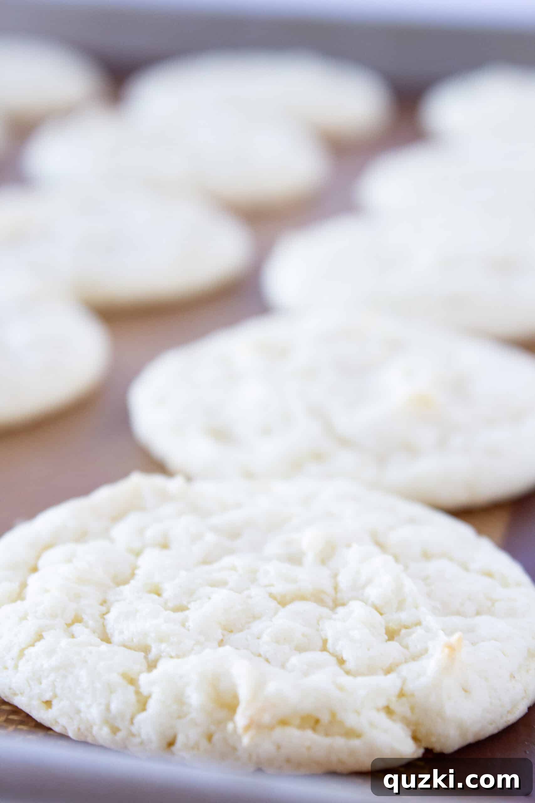 Cake Mix Magic: White Sheet Cake Cookies 6 Freshly baked White Sheet Cake Cookies cooling on a wire rack.