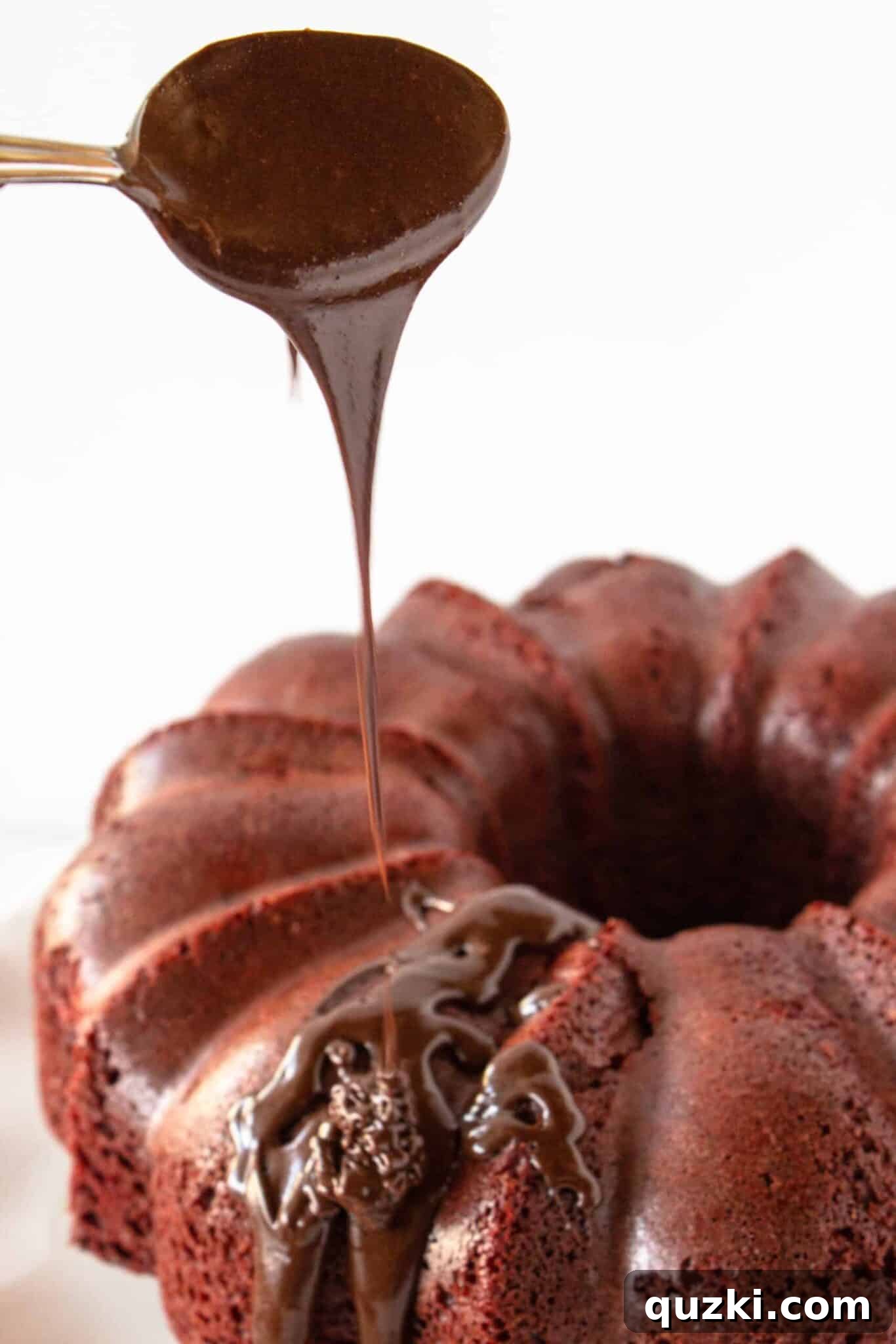 Black Bottom Red Velvet Bundt Cake Made Easy 11 Drizzling the chocolate glaze generously over the cooled Bundt cake.