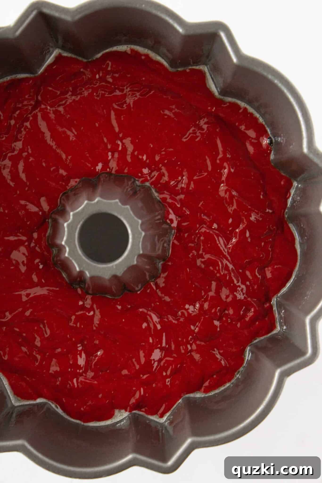 Black Bottom Red Velvet Bundt Cake Made Easy 5 Pouring the red velvet cake batter into the prepared bundt pan.