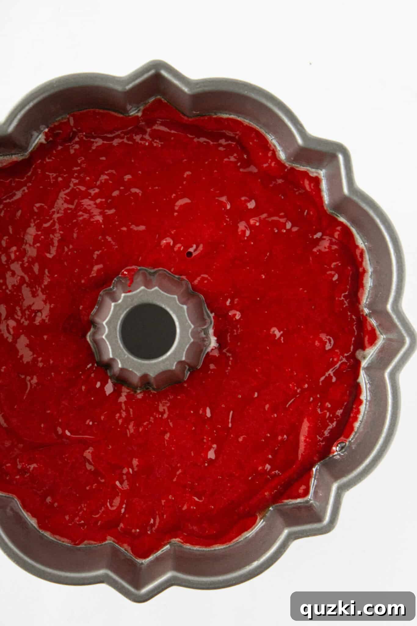 Black Bottom Red Velvet Bundt Cake Made Easy 8 The cake batter covering the cream cheese filling, ready for baking.