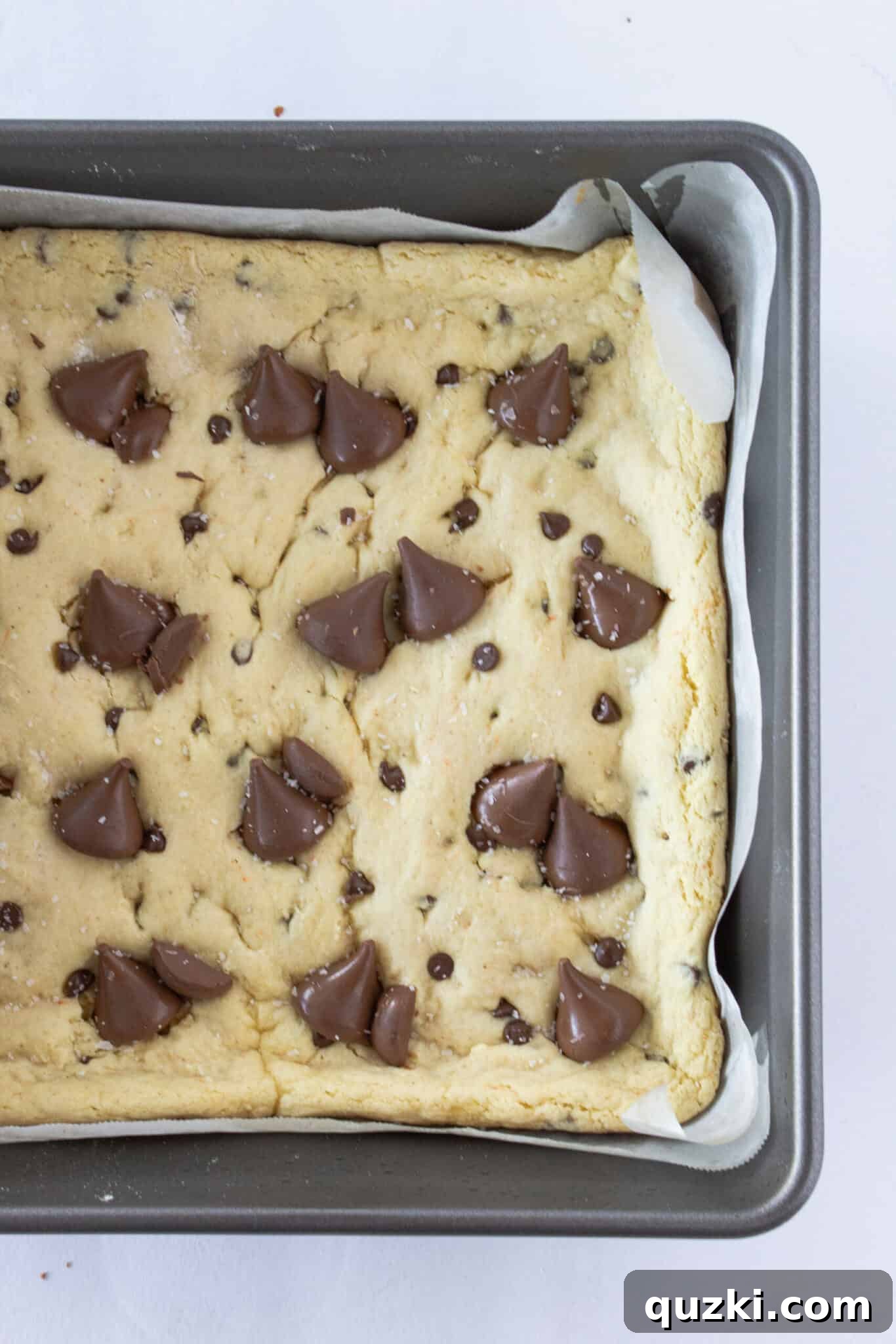 Toasted Butter Hershey Kiss Cookie Bars 8 Adding Hershey's Kisses to the warm cookie bars and the final delicious product cut into squares.