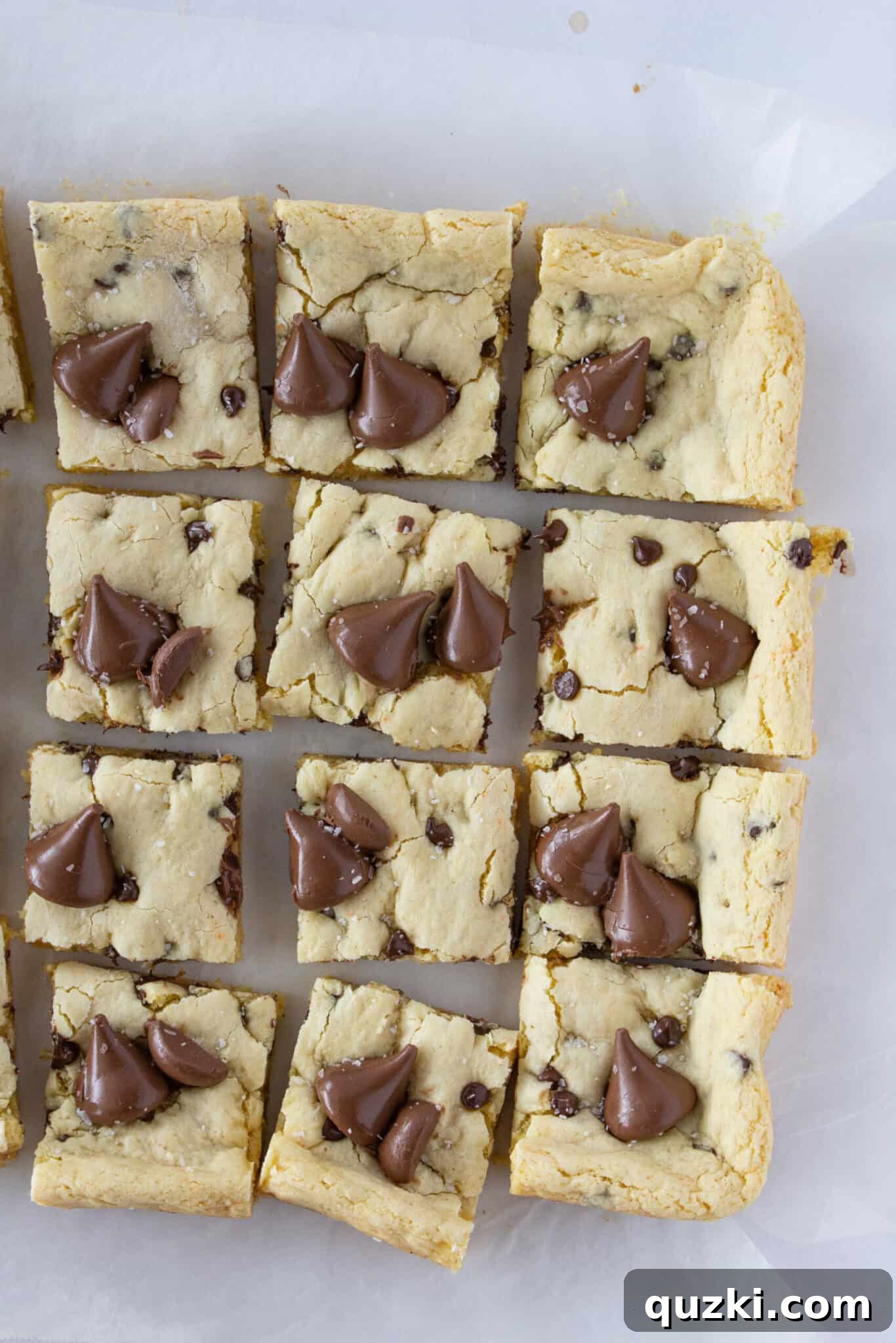 Toasted Butter Hershey Kiss Cookie Bars 9 Illustrating the process of pressing Hershey's Kisses into the baked bars and neatly cutting them.