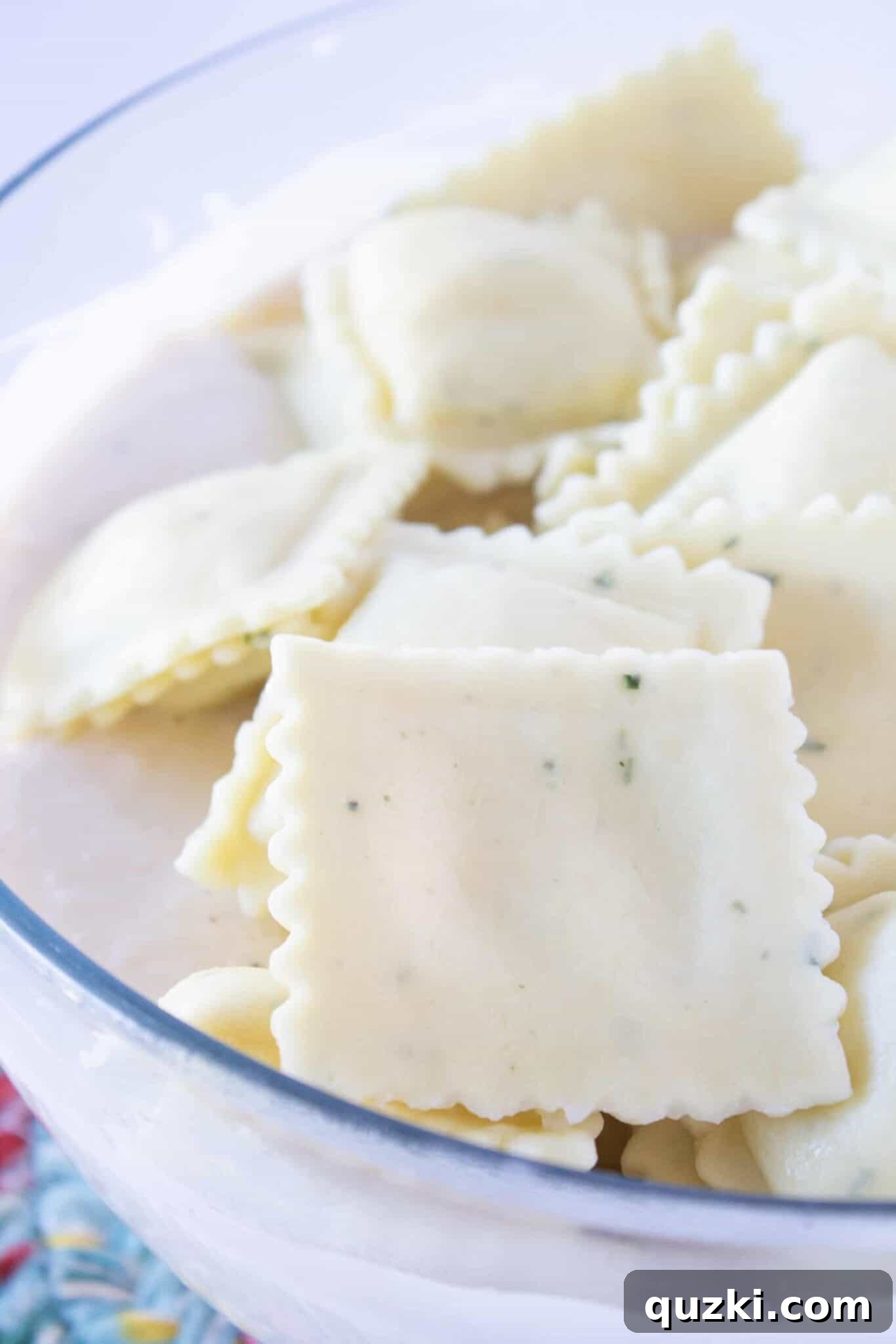 Creamy Chicken Alfredo Ravioli Bake 5 A close-up view of the prepared Alfredo sauce with added ingredients, ready to be combined.