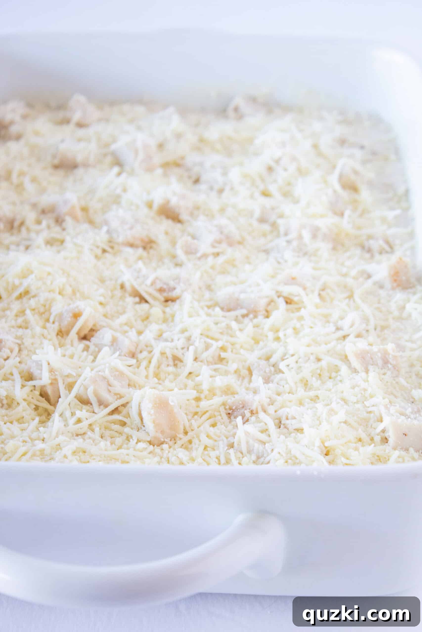 Creamy Chicken Alfredo Ravioli Bake 8 Topping the Chicken Ravioli Casserole generously with shredded mozzarella and Parmesan cheese before baking.