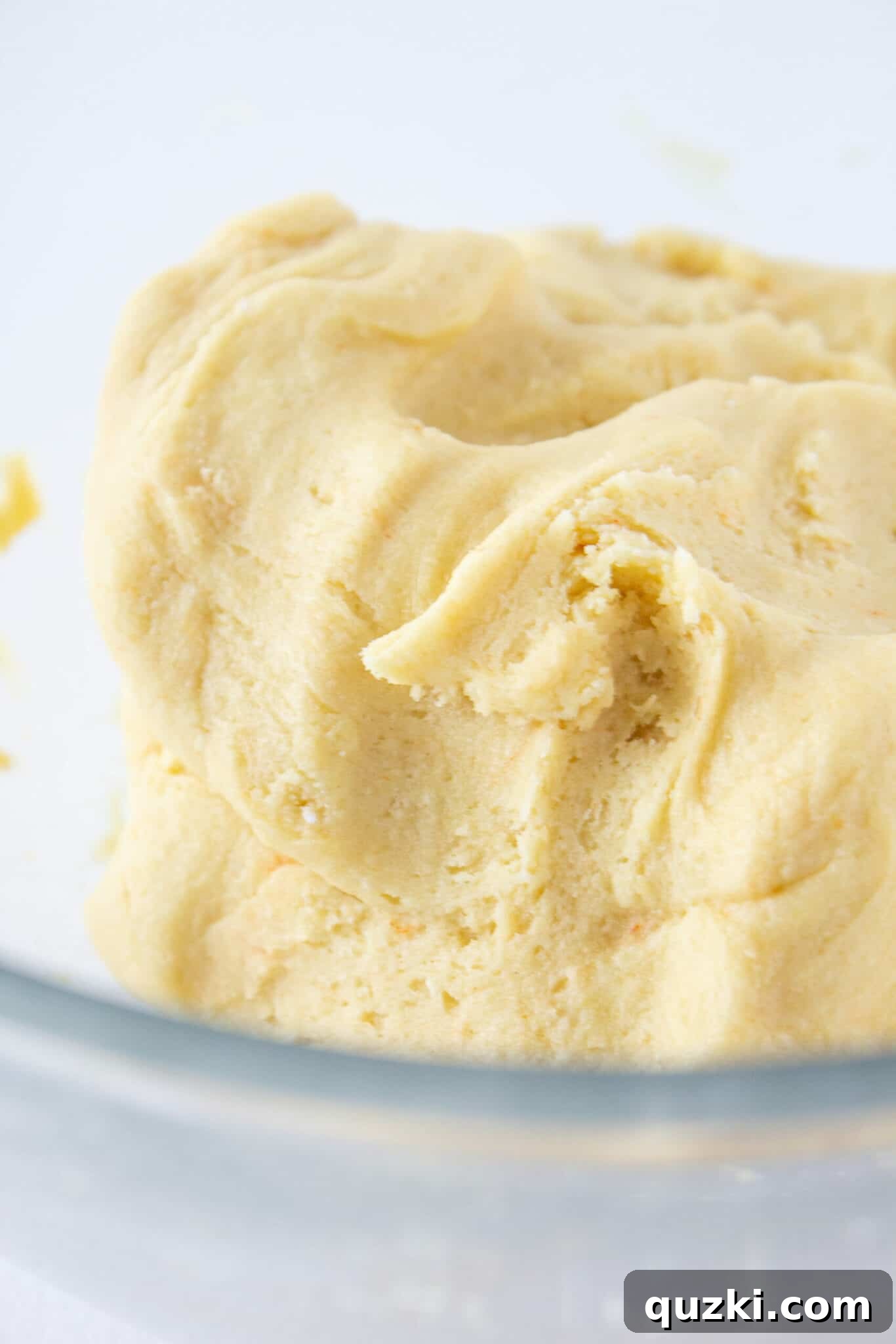 Cinnamon roll cookie dough in a mixing bowl after initial preparation