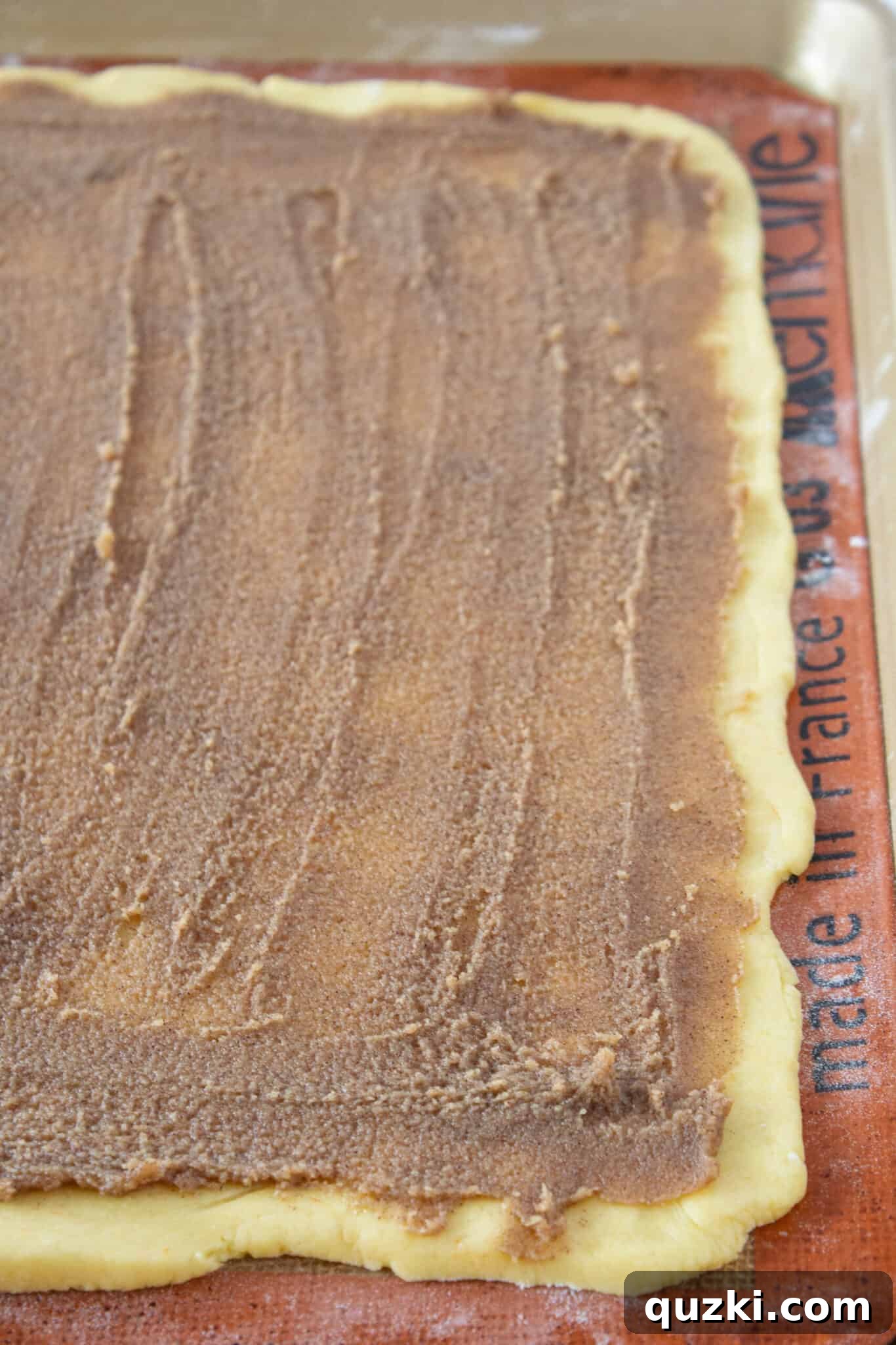 Cinnamon brown sugar filling spread evenly over cake mix cookie dough