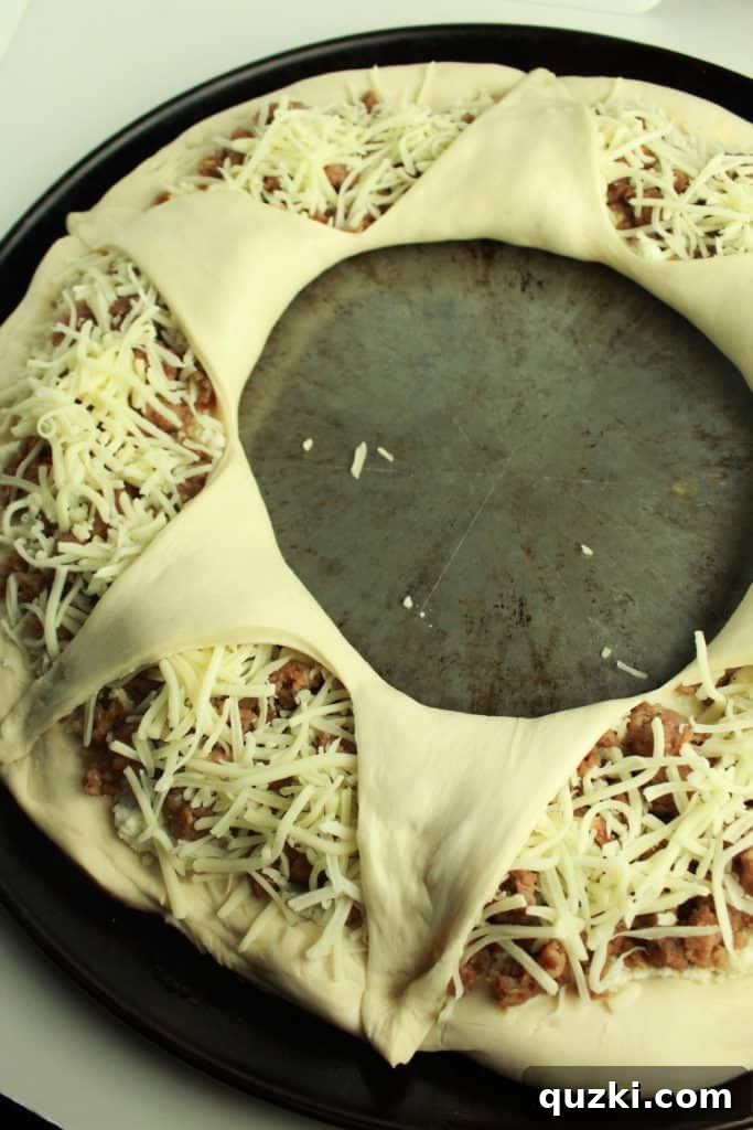 Stuffed Italian Sausage and Ricotta Pizza Ring 8 A glorious shot of the freshly baked Italian Sausage Ricotta Pizza Ring, boasting a beautifully crispy, golden-brown crust.
