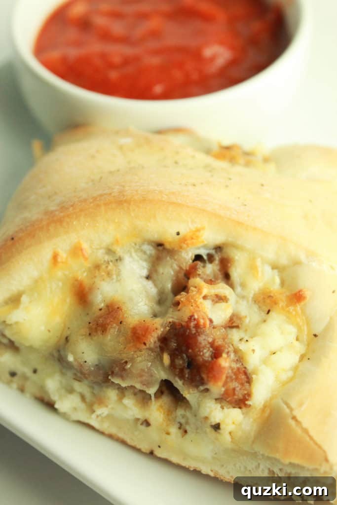 Stuffed Italian Sausage and Ricotta Pizza Ring 10 A mouth-watering close-up of a slice of Italian Sausage Ricotta Pizza Ring, revealing its rich, melted cheese and savory Italian sausage filling.