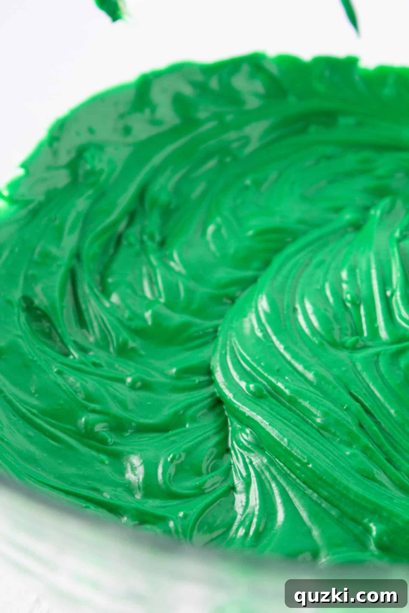 Effortless Green Velvet Cake Mix Cookies 4 Mixing green food coloring into cream cheese and butter for Green Velvet Cookies.