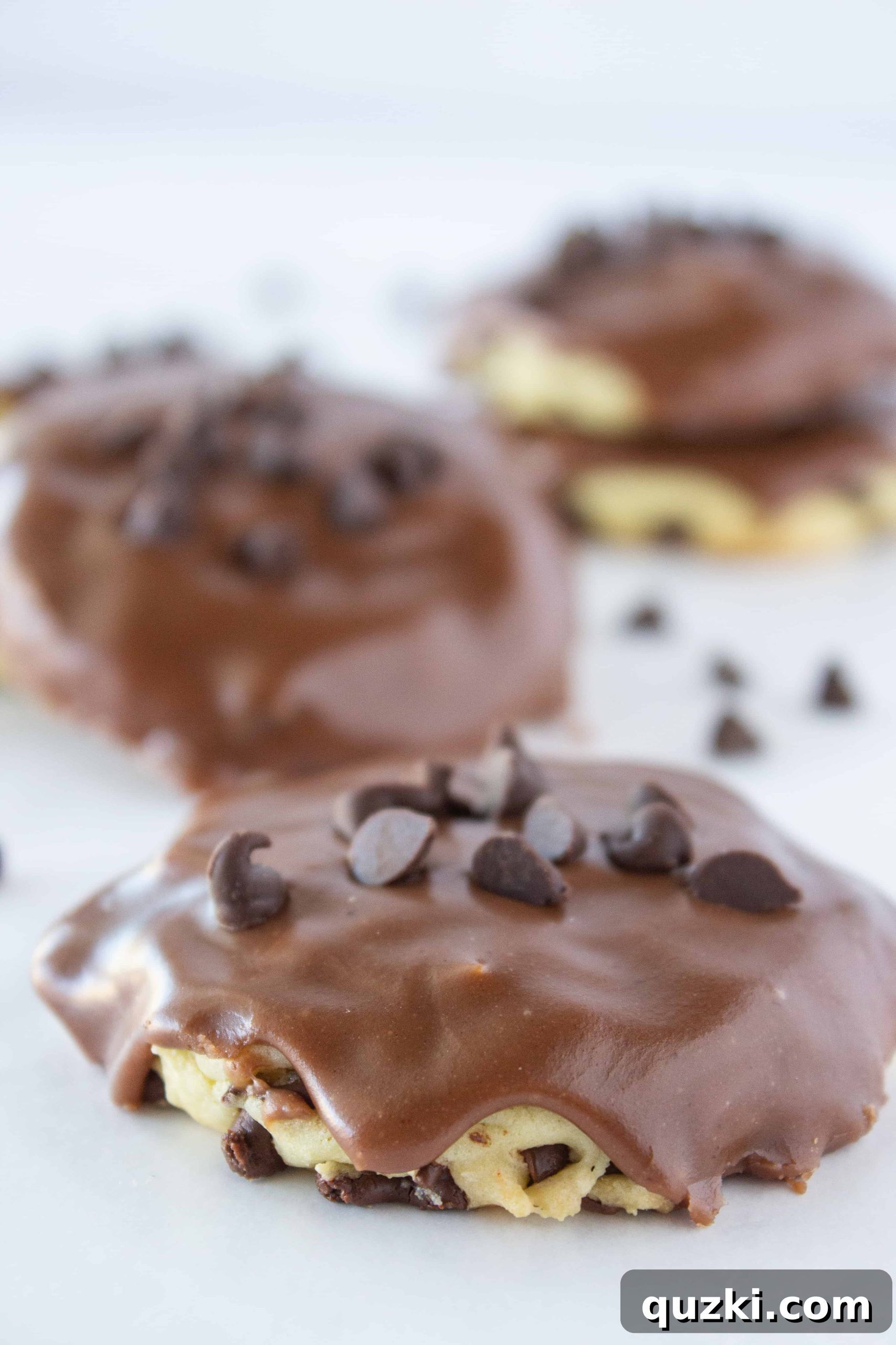 Close-up of freshly baked Cake Mix Cookies: Chocolate Chip Sheet Cake Cookie Recipe with chocolate frosting, featured by top US cookie blogger, Practically Homemade
