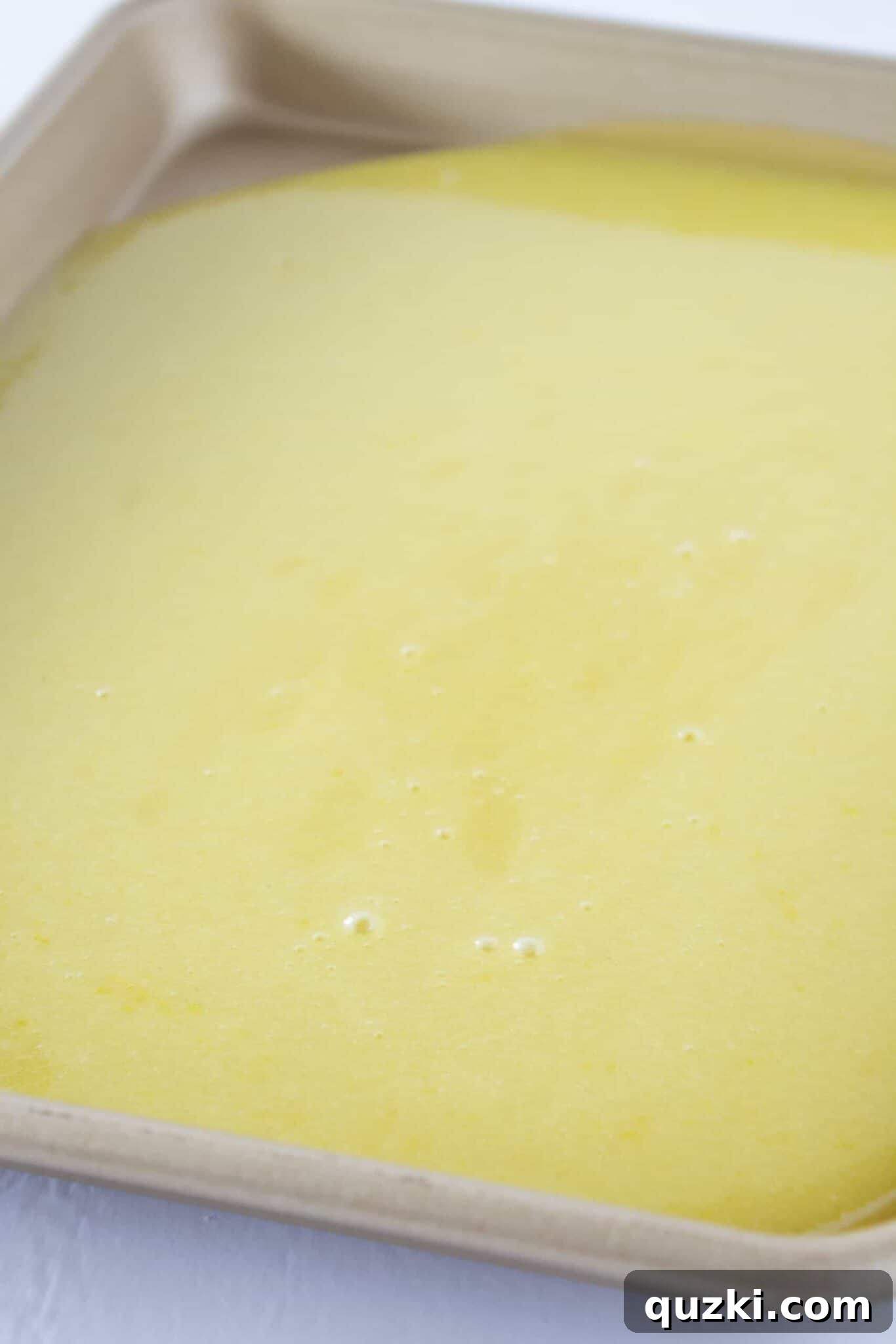 The vibrant homemade lemon filling cooling on a baking sheet, preparing it for the final step of filling the cookie cups.