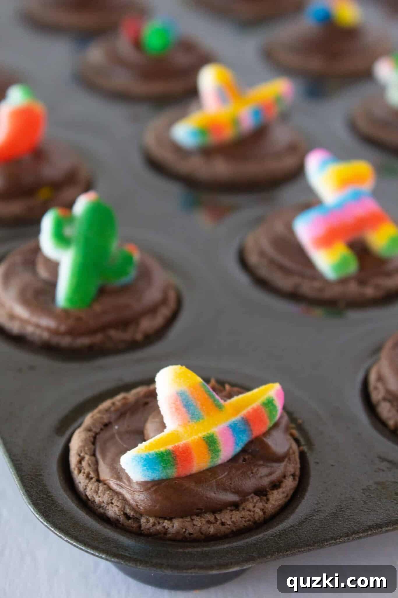 Cake Mix Shortcut Pinata Cookies 11 Decorating the frosted Pinata Cookies with festive Cinco de Mayo themed sprinkles and sugar toppers.