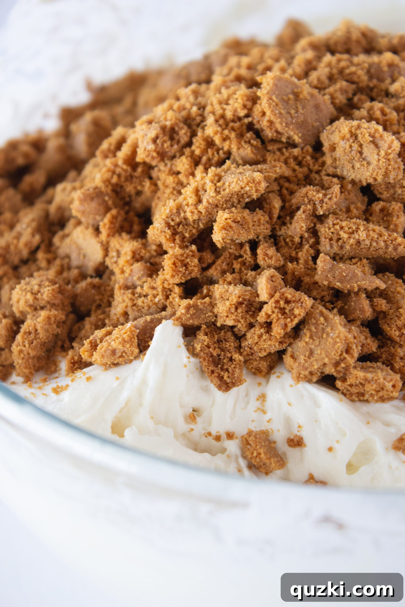 Decadent Cookie Butter No-Bake Cheesecake 8 The creamy cheesecake filling with crushed Biscoff cookies mixed in