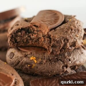 Chocolate Orange Cookie Mix Recipe — Quick Cake Mix Cookies 9 Stacks of chocolate orange cookies with a bite taken from one.